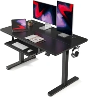 FEZIBO Height Adjustable Electric Standing Desk with Keyboard Tray, 120 x 60 cm Sit Stand up Desk with Splice Board, Black Frame/Black Top